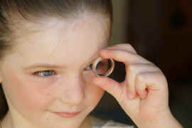 Haley looks through ring.jpg (115368 bytes)